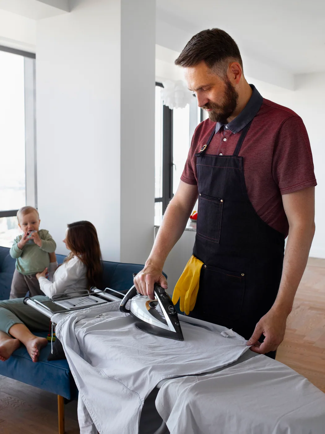 A shirt being pressed flat with a steam iron