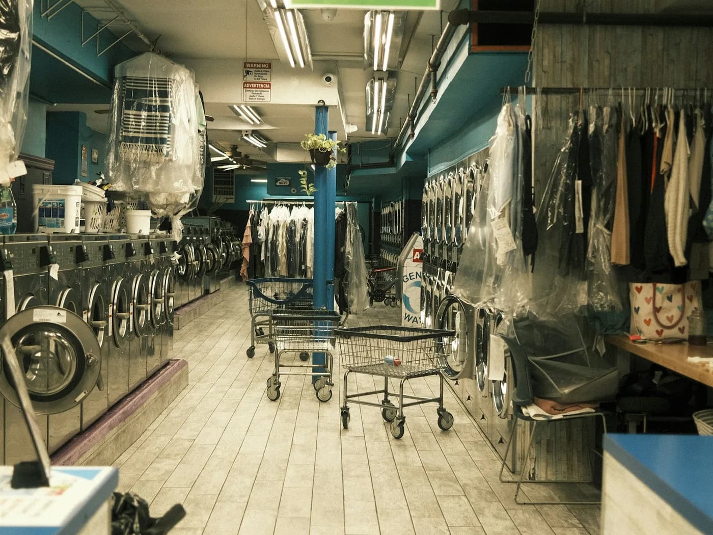 The washing and dry-cleaning floor, with machines and garment rails